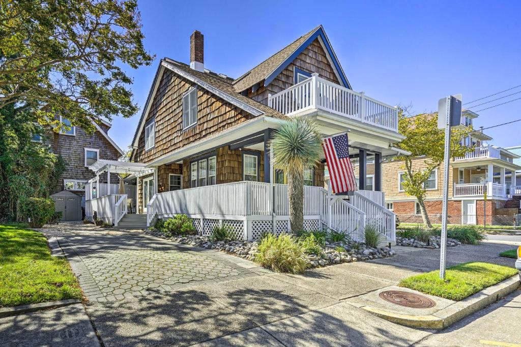 a house with an american flag in front of it at Idyllic Atlantic City Home - 1 Block to Beach in Atlantic City