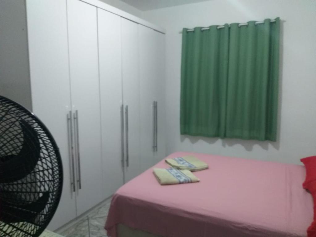 Cama ou camas em um quarto em Casa Lagoa Piscina