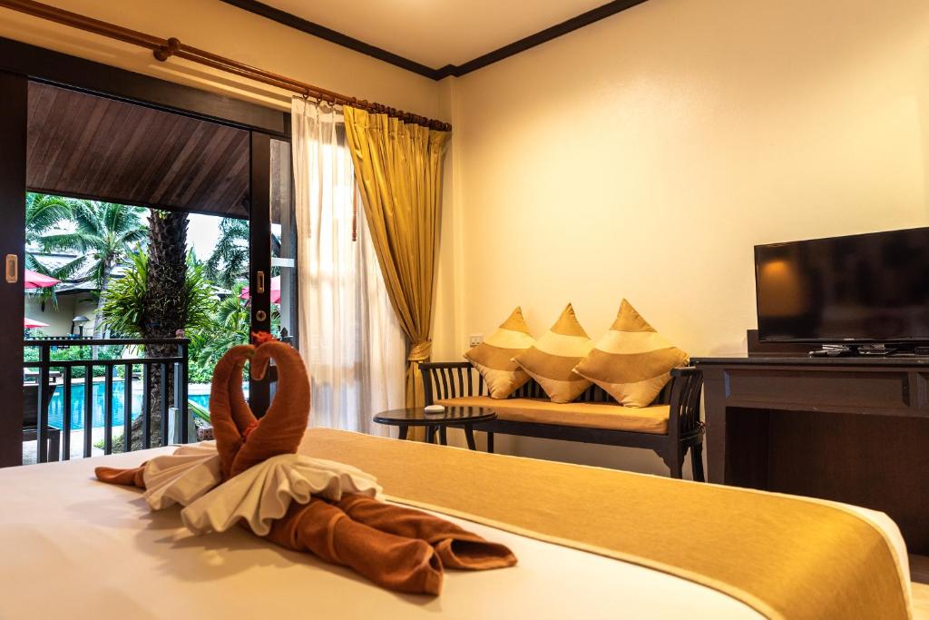 Postel nebo postele na pokoji v ubytování Am Samui Palace