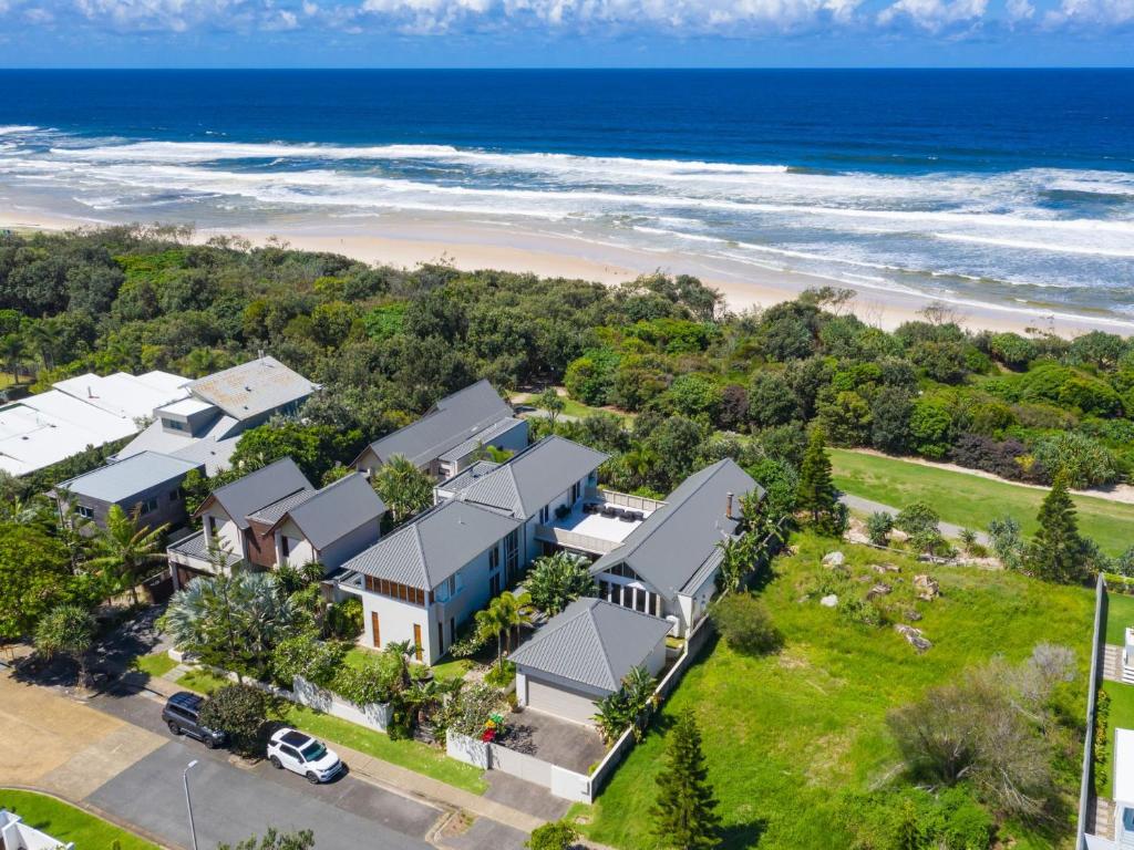 an aerial view of a house and the beach at Beachfront On Northpoint in Kingscliff