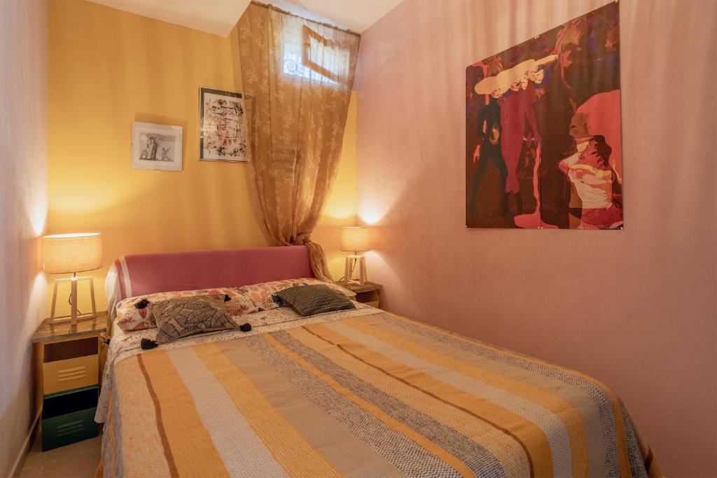 Łóżko lub łóżka w pokoju w obiekcie Villetta Cicciuli