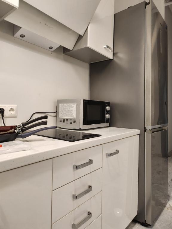 Kuchyň nebo kuchyňský kout v ubytování Hostel Riga KVANT
