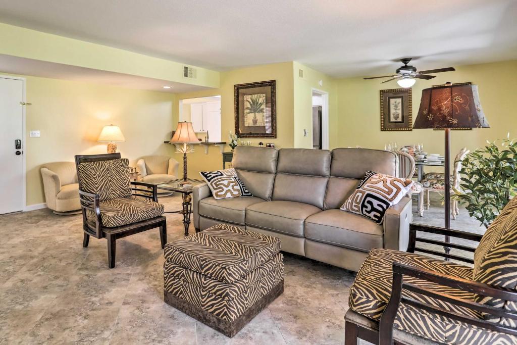 a living room with a couch and chairs at Cathedral City Golf Course Condo with Patio in Cathedral City