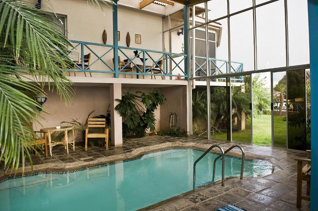 a house with a swimming pool and a balcony at Sea-View Zum Sperrgebiet in Lüderitz