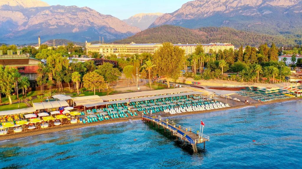 a large pool with a dock in the water at Crystal De Luxe Comfort Collection - All Inclusive in Kemer