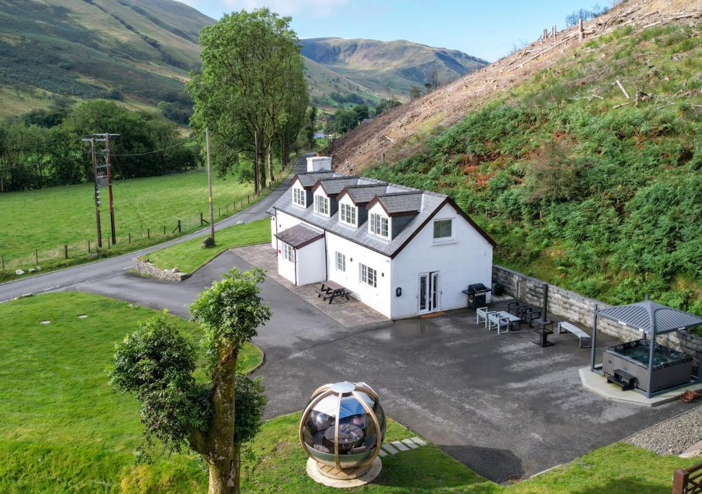 an aerial view of a white house on a hill at Esgair Wen in Pentre-briwnant