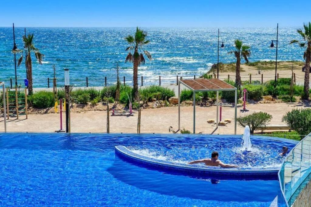 Bazén v ubytování Sea Senses Punta Prima by Villas&You nebo v jeho okolí