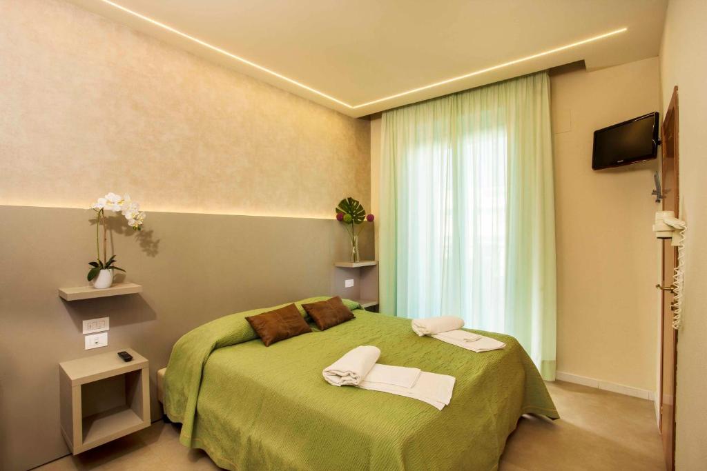 Postel nebo postele na pokoji v ubytování Hotel Beaurivage
