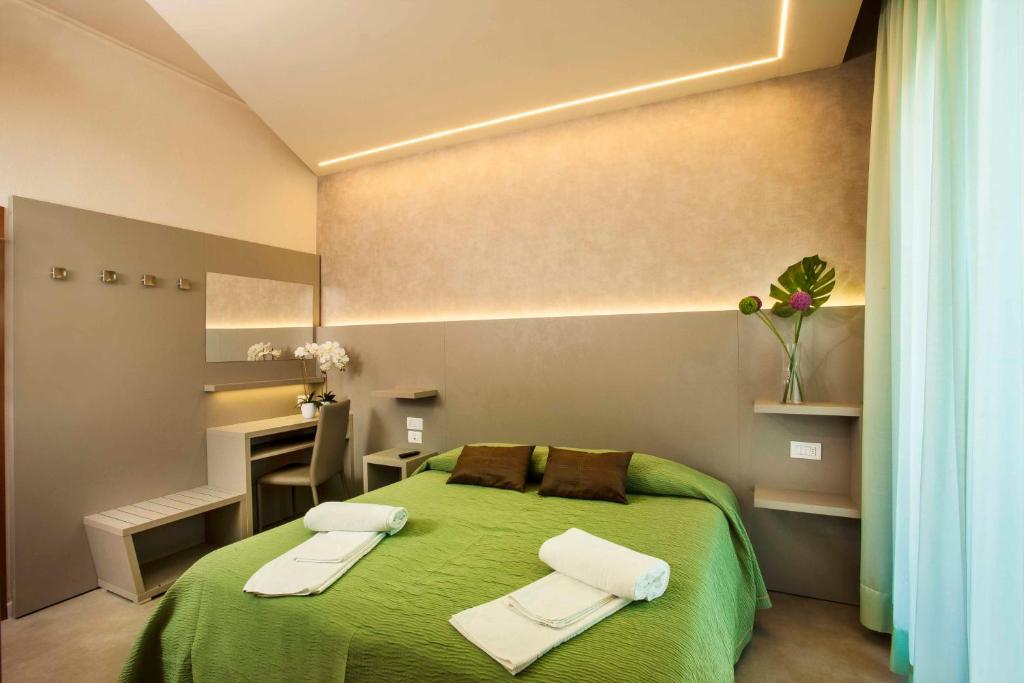 Postel nebo postele na pokoji v ubytování Hotel Beaurivage
