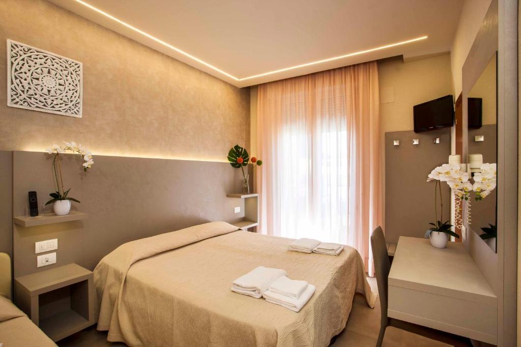 Postel nebo postele na pokoji v ubytování Hotel Beaurivage