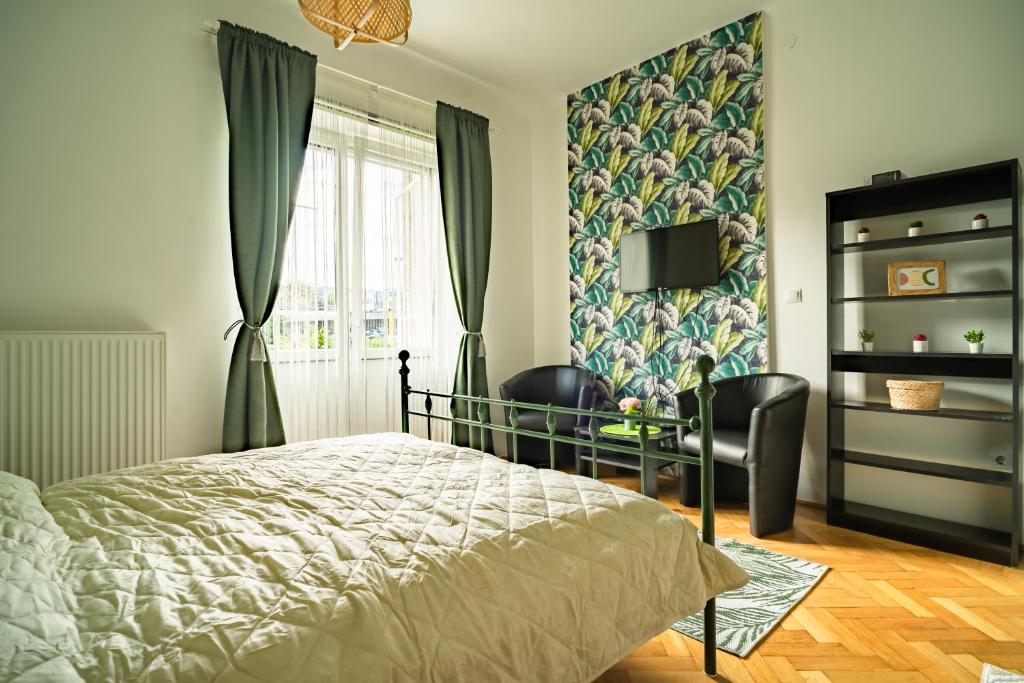 A bed or beds in a room at Colors Apartment