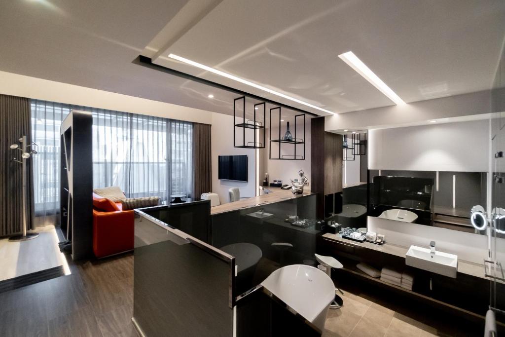 TV a/nebo společenská místnost v ubytování Starhaus Hotel