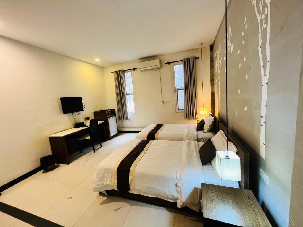 Postel nebo postele na pokoji v ubytování Asiban Quay Boutique Hotel