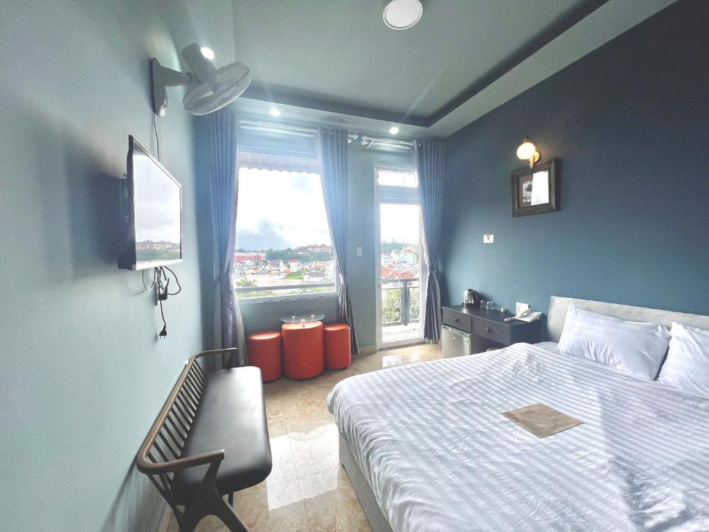 Postel nebo postele na pokoji v ubytování Khách Sạn Hưng Nguyên Valley ĐàLạt