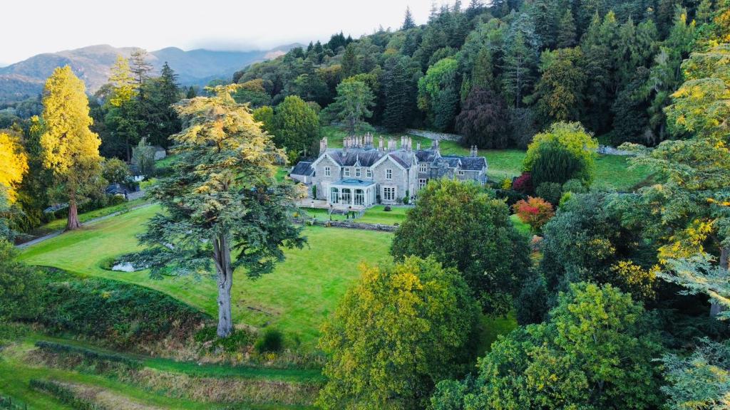 an aerial view of a large house on a hill at The Lake House, Wansfell Holme, Windermere in Ambleside