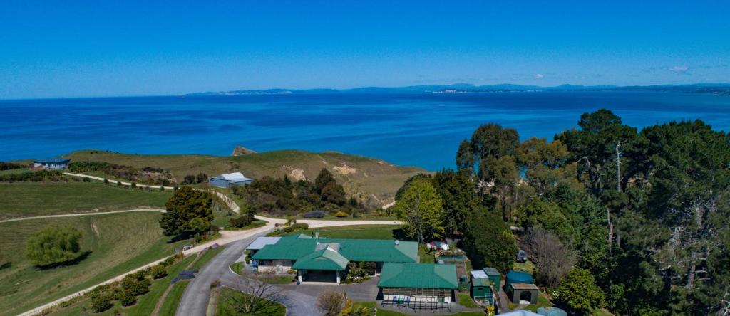 an aerial view of a house with the ocean in the background at Tango10 Accommodation - Best views in Hawke's Bay in Tangoio