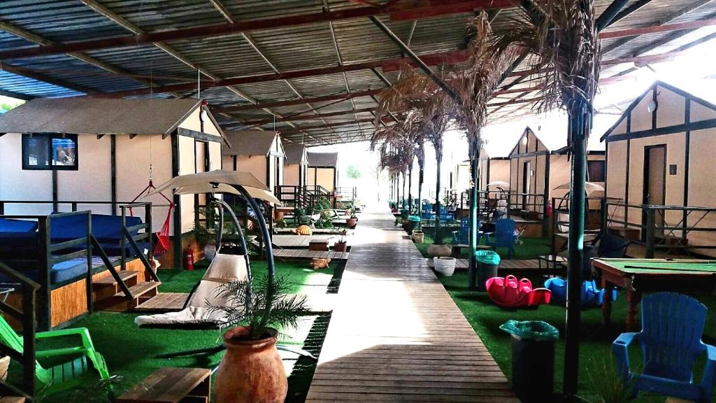 a room with tables and chairs in a building at Adam's Farm in Eli Ad