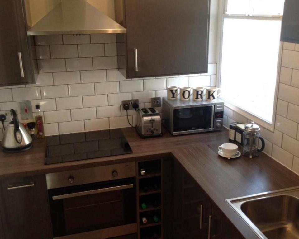 Kuchyň nebo kuchyňský kout v ubytování Coppergate Apartments