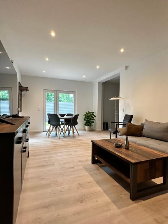 a living room with a couch and a table at Ferienwohnung Hardo in Alt Schwerin