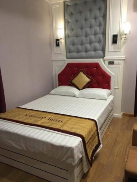 Postel nebo postele na pokoji v ubytování Kawasaki Hotel Cầu Giấy