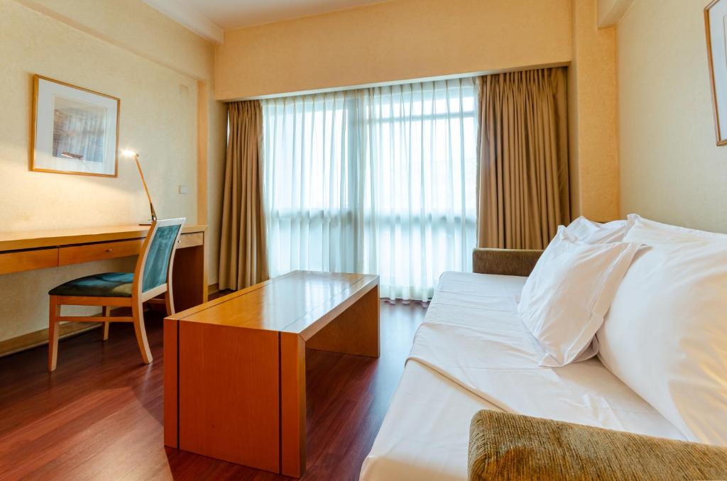 Uma cama ou camas num quarto em Hotel Roma