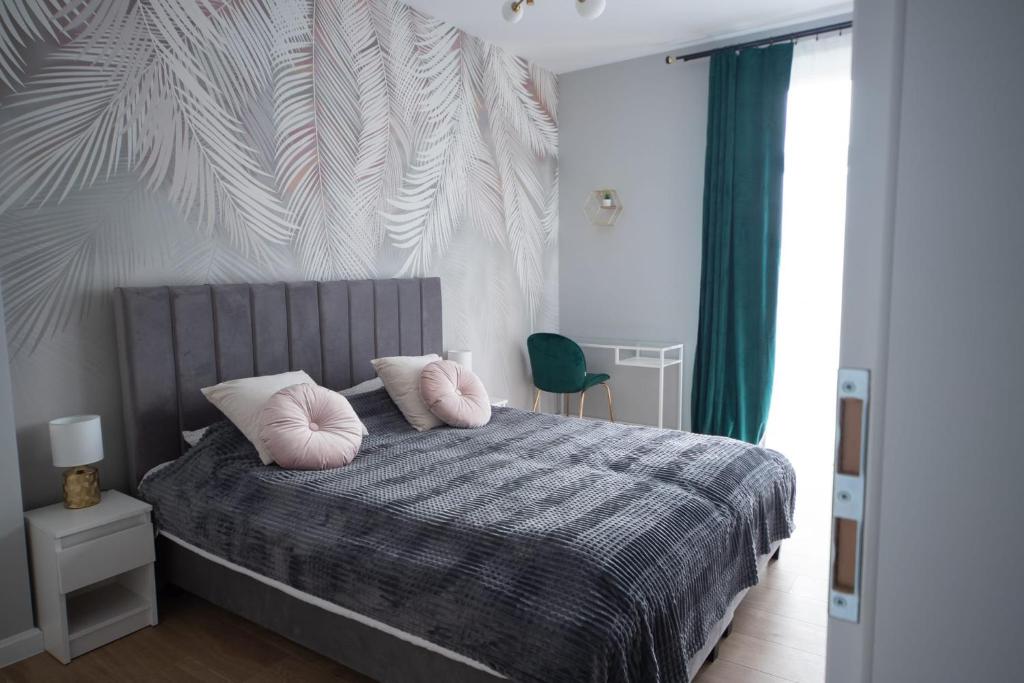 Posteľ alebo postele v izbe v ubytovaní Kotlarska Apartments