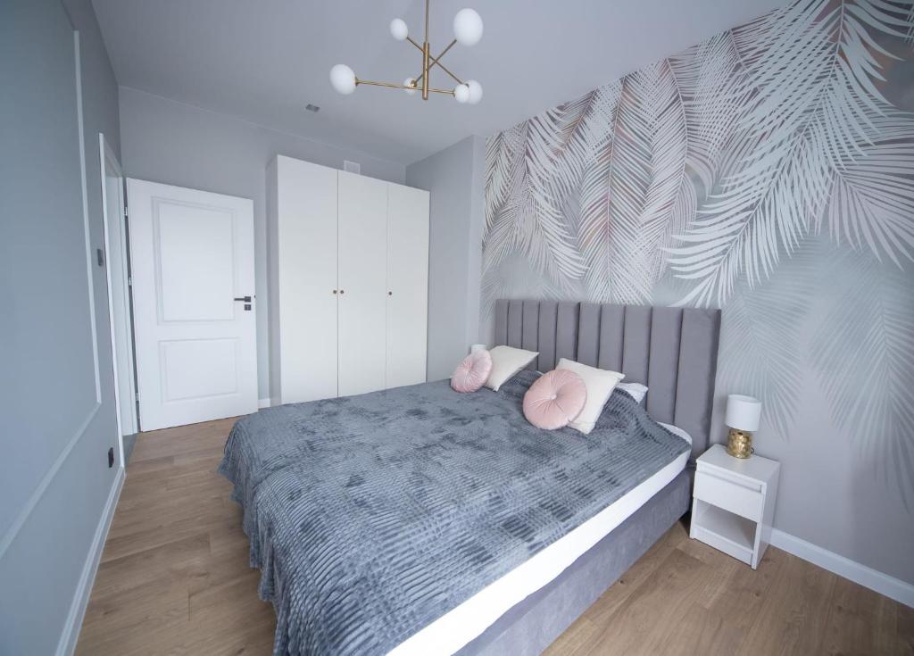 Posteľ alebo postele v izbe v ubytovaní Kotlarska Apartments
