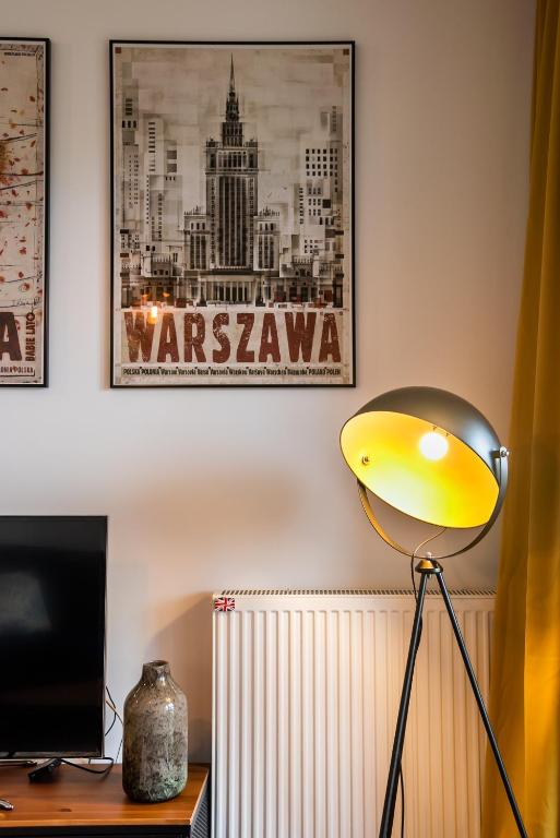 Televízia a/alebo spoločenská miestnosť v ubytovaní Navy Blue Apartment