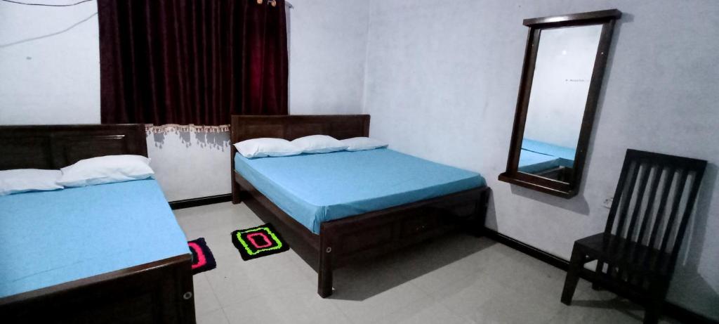 Postel nebo postele na pokoji v ubytování Serene Homestay