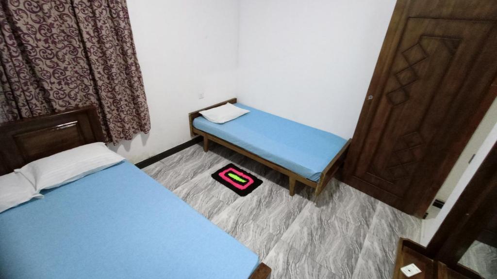 Postel nebo postele na pokoji v ubytování Serene Homestay