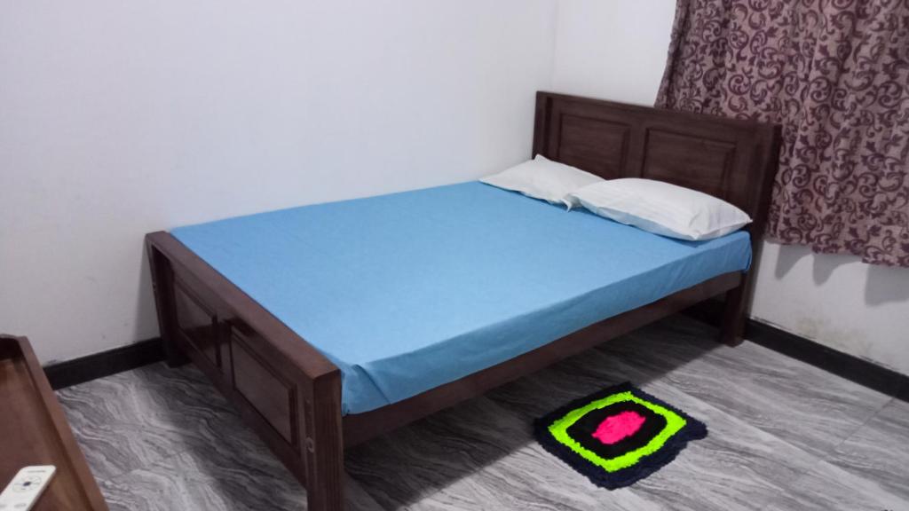 Postel nebo postele na pokoji v ubytování Serene Homestay