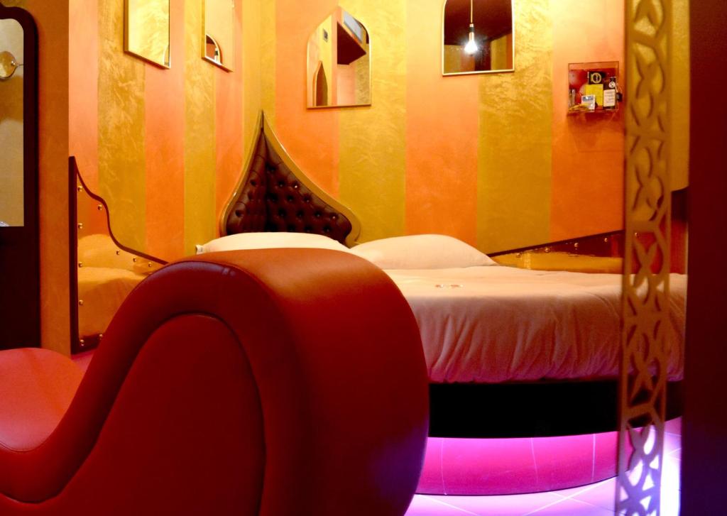 Postel nebo postele na pokoji v ubytování C rooms - Love Motel Monza