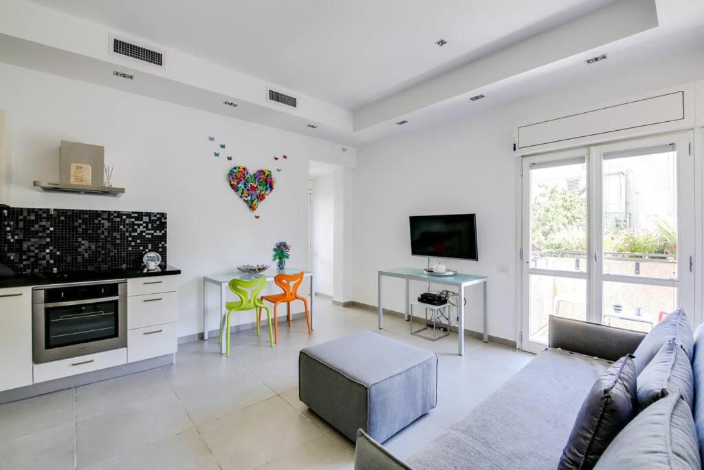 a living room with a couch and a table at Central 2BR in Ben Yehuda by Holiday-rentals in Tel Aviv