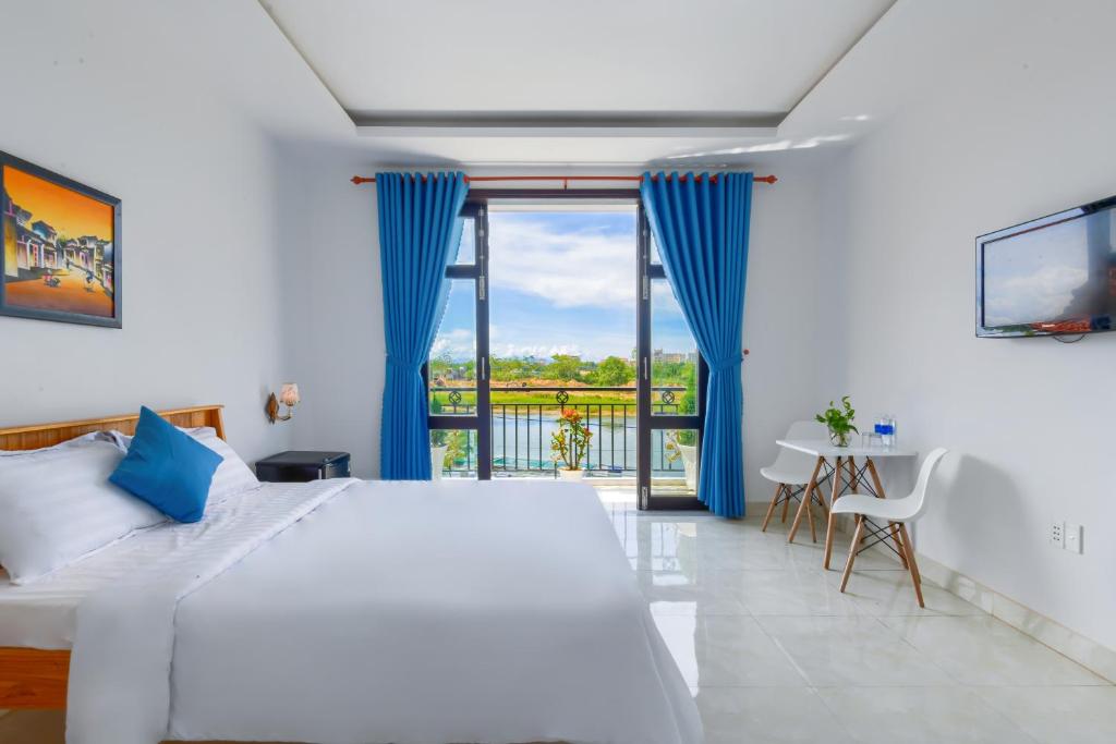 Postel nebo postele na pokoji v ubytování Gió Chiều Homestay - Riverside & Swimming pool