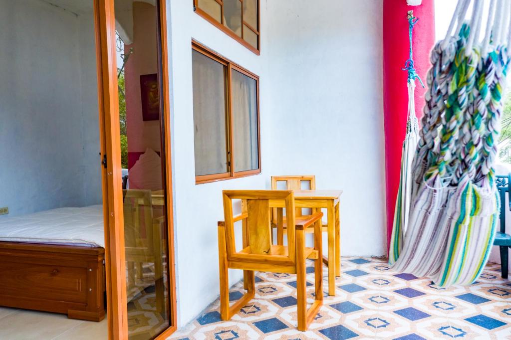 Postel nebo postele na pokoji v ubytování Royal Galápagos Inn