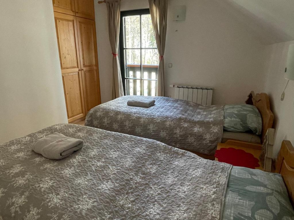 Postel nebo postele na pokoji v ubytování Chalet ANRA Pohorje