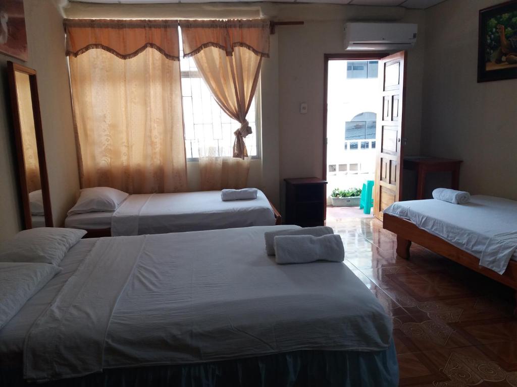 Postel nebo postele na pokoji v ubytování Hostal Miconia