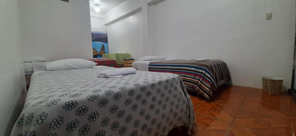 Postel nebo postele na pokoji v ubytování Hostal Miconia