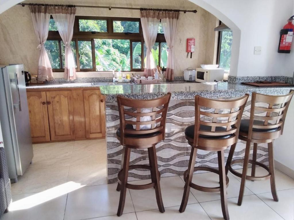 A cozinha ou kitchenette de Belle Rose Vue guest house