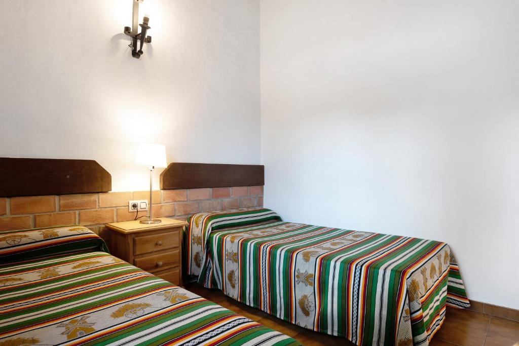 Posteľ alebo postele v izbe v ubytovaní Casa Alberto