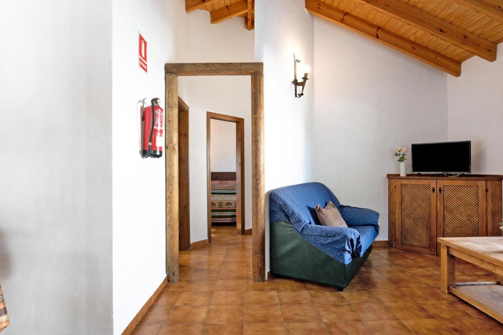 Televízia a/alebo spoločenská miestnosť v ubytovaní Casa Alberto
