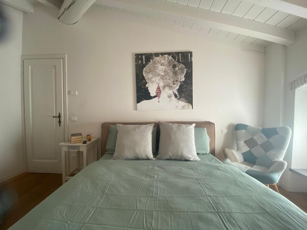 A bed or beds in a room at Ca Paradiso