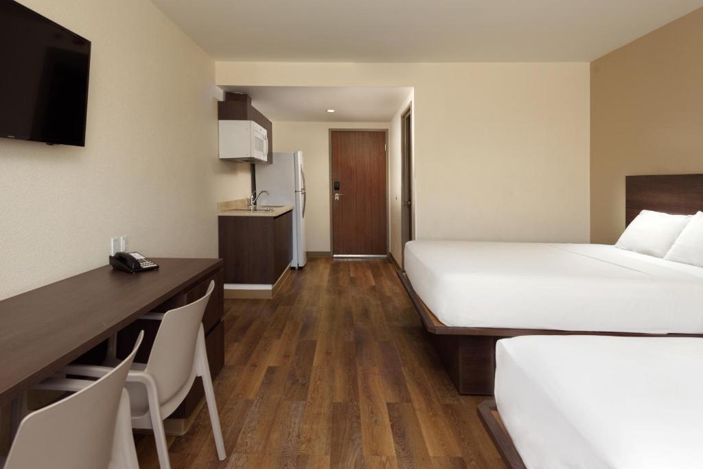 Postel nebo postele na pokoji v ubytování Extended Suites Coatzacoalcos Forum