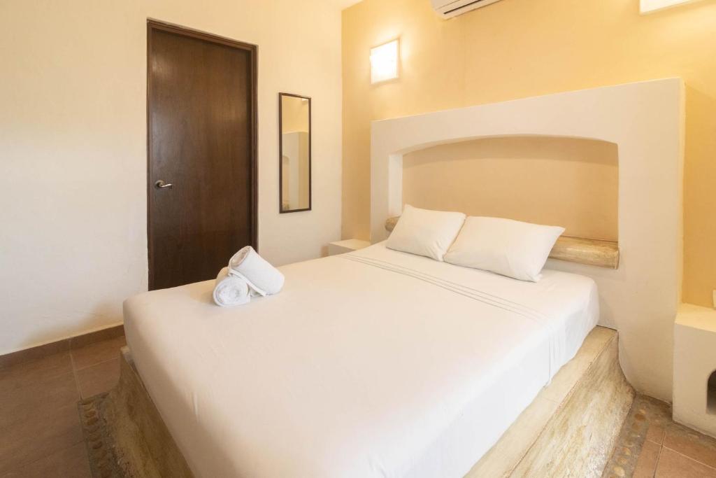 Postel nebo postele na pokoji v ubytování Hotel Boutique Pachamama