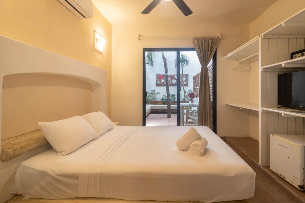 Postel nebo postele na pokoji v ubytování Hotel Boutique Pachamama
