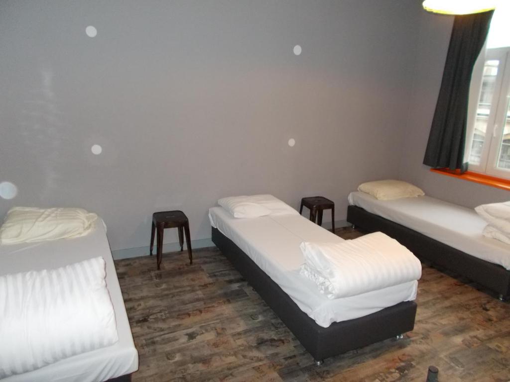 Postel nebo postele na pokoji v ubytování Urban City Centre Hostel