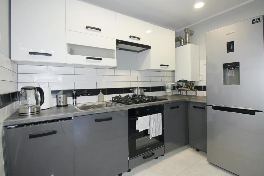 Kuchyň nebo kuchyňský kout v ubytování Apartament Dzikowiec