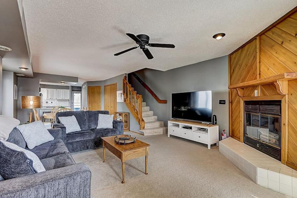 a living room with a couch and a tv at Family Dreams Condo at Lighthouse Cove in Wisconsin Dells