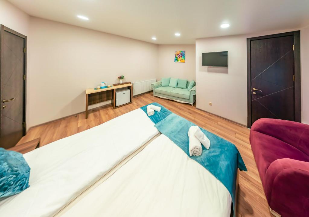 Postel nebo postele na pokoji v ubytování Hotel Classic Suites