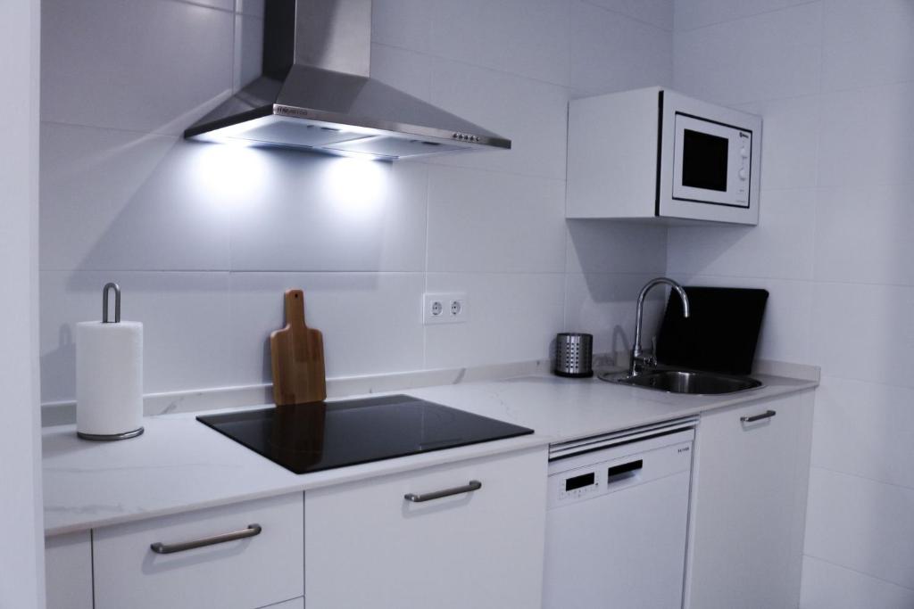 Kuchyňa alebo kuchynka v ubytovaní Zona5 Apartamentos Turísticos